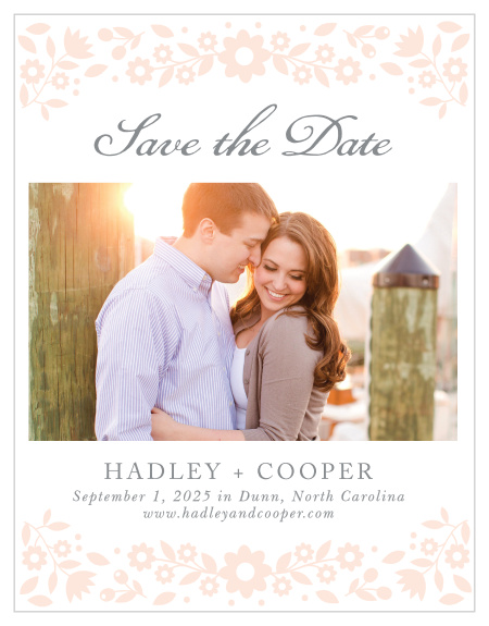 Delicate flowers accent the top and the bottom of the Floral Frame Save-the-Date Magnets.