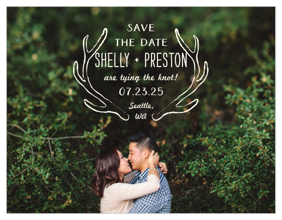 Rustic antlers frame your text on the Back Country Save-the-Date Cards.