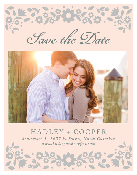 Delicate flowers accent the top and the bottom of the Floral Frame Foil Save-the-Date Magnets.