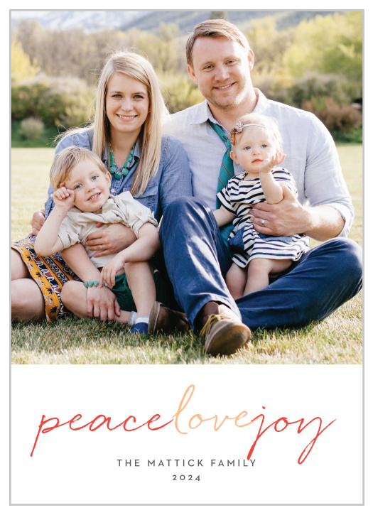A large photo of your family decorates the majority of our Multi Script Holiday Cards; underneath, in alternating red and peach colors, an elegant script spells out your holiday well-wishes.
