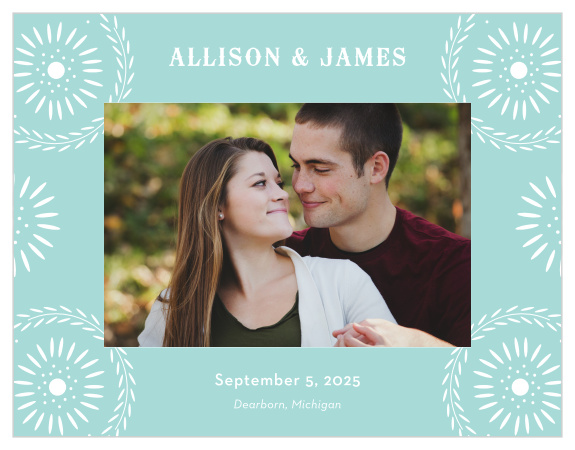 Our Papel Confetti Save-the-Date Cards feature a daisy-esque papel picado design that frames your engagement photo in white and pastel, glass blue.