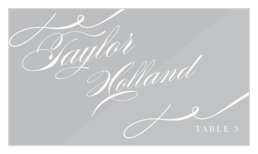 Swirling Cheri Clear Place Cards feature intricate, swirling calligraphy for every guest's name, serving as a shining beacon for every single table-top. 