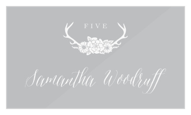 Our Blossoming Antlers Clear Place Cards feature a set of antlers with a group of flowers nestled in them at the top.