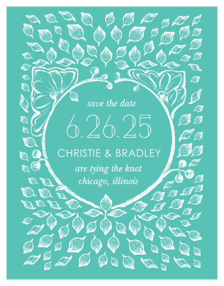 A  white, vintage, leaf adorned crown frames the In the Garden Save-the-Date Cards along with a deluge of intricate leaves contrasted against a deep aqua background.