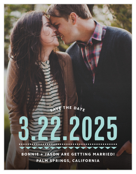 Deco Charm Save-the-Date Cards begin with a photo of the two of you as their foundation, add the date of your wedding in a stunning glass-blue, and then finish with the other details of your wedding in small, sheer white typeface at the bottom.