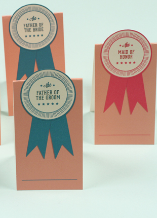 Replace the standard place cards for your wedding party with our Pop-Up Ribbon Place Card at the reception table. These thoughtful place cards are a nice way to make each member of your wedding party feel special and it's a fun addition to your reception table decor.Size: 2" x 3 1/2 folded", set up 3 on a page.This is a Digital Item for you to print on your own, no printed cards will be mailed to you.&nbsp;After you purchase this item, you'll receive a confirmation email. In this email click on the link "Pop-up Ribbon Place Card PDF" to instantly download your PDF.